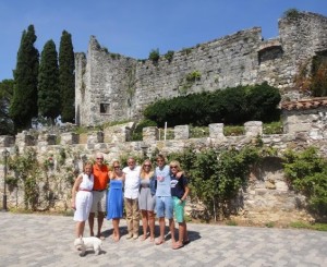 The Pizio-Biroli and Kemper Valentine family standing in front of the 11th century castle where Shakespeare's Romeo and Juliet is documented to have taken place. 