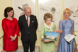 Agnes Matthysen, Ambassador Matthysen, Ina Ginsburg, and Kathy Kemper review Agnes Matthysen's book