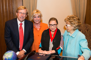 The Honorable Ted Olson, Coach Kathy Kemper and Ina Ginsburg present Justice Ruth Bader Ginsburg with IFE's 2014 Cultural Diplomacy Award.